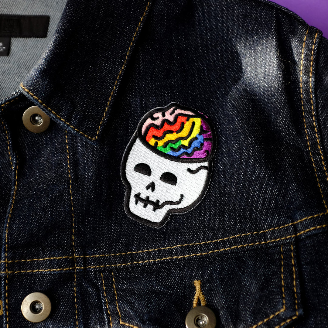 Patches Collection Image: Queerie Pride Brain Skull Embroidered Patch by Bianca Designs.