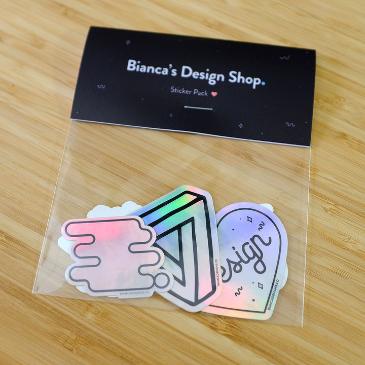 Designer Holographic Sticker Pack featuring the Impossibly Gay Triangle, Design Lover Heart, Tech Heart, Cursive Internet, and the Liquid Pride Symbol. Made by Bianca Designs