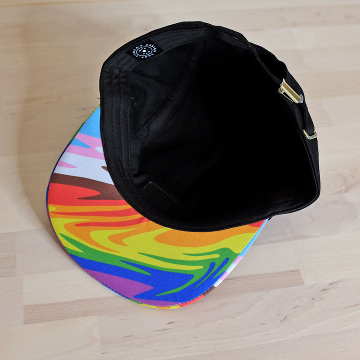 Under view of the Inclusive Future Pride Camper Hat by Bianca Designs.