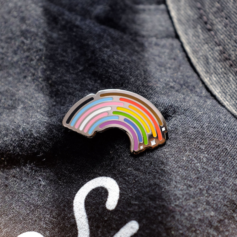 Inclusive Rainbow Pride Pin in Silver pinned to a T-shirt by Bianca Designs