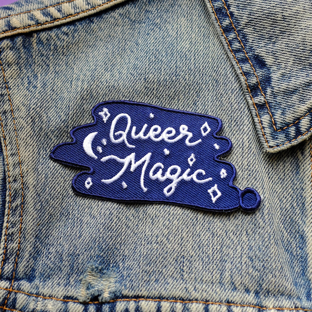 Queer Magic Embroidered Patch by Bianca Designs. The patch is being worn on a light denim jacket.