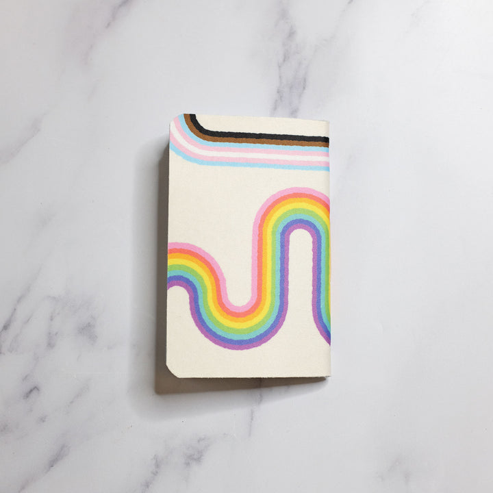Backside of the Rainbow Road Inclusive Pride Notebook by Bianca Designs.