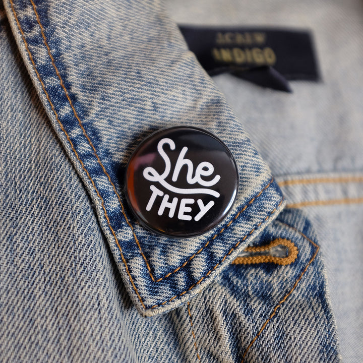 She/they Pronouns Button by Bianca Designs.