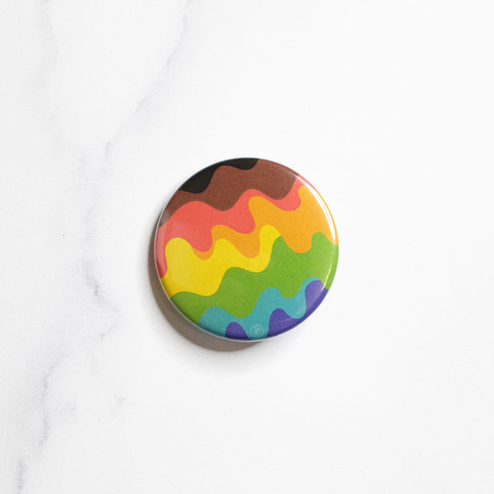 Wavy QTPOC Pride Rainbow Button by Bianca Designs.