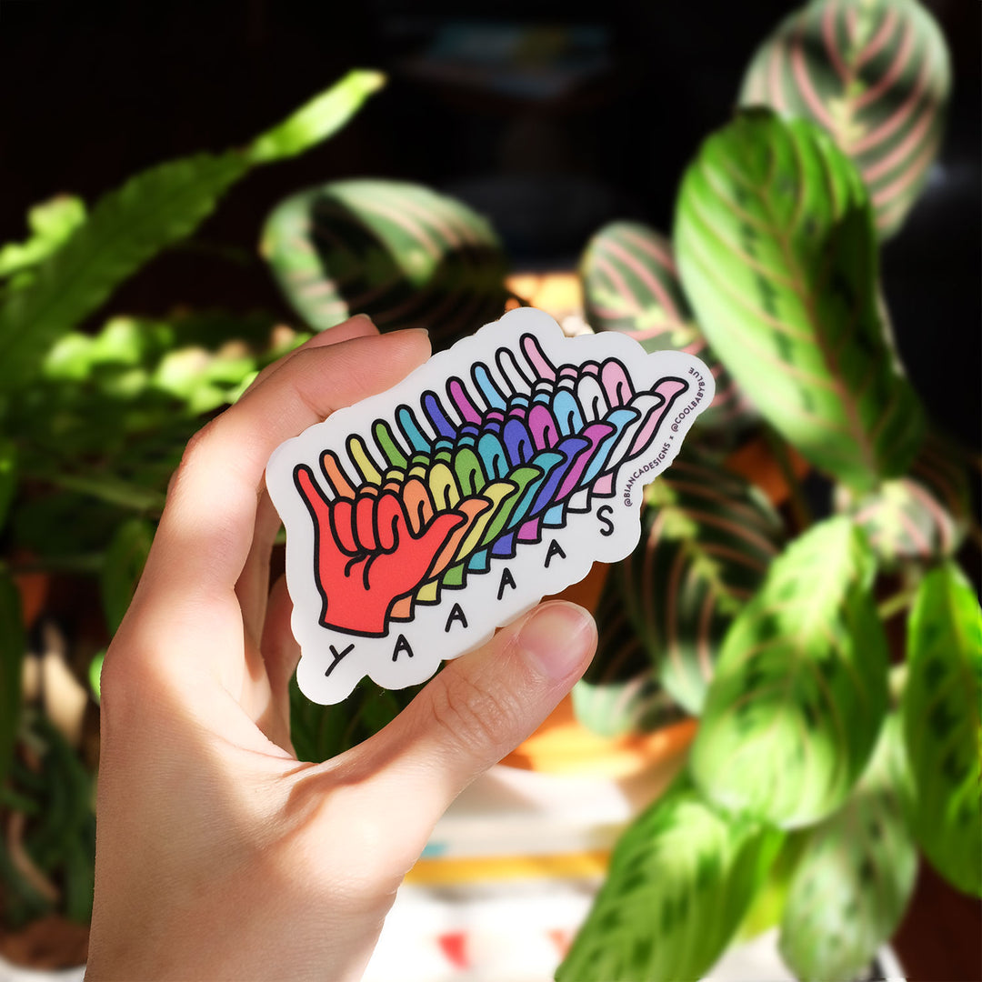 Hand holding the Yaaaas in ASL Sticker by Bianca Designs and Gregor Lopes